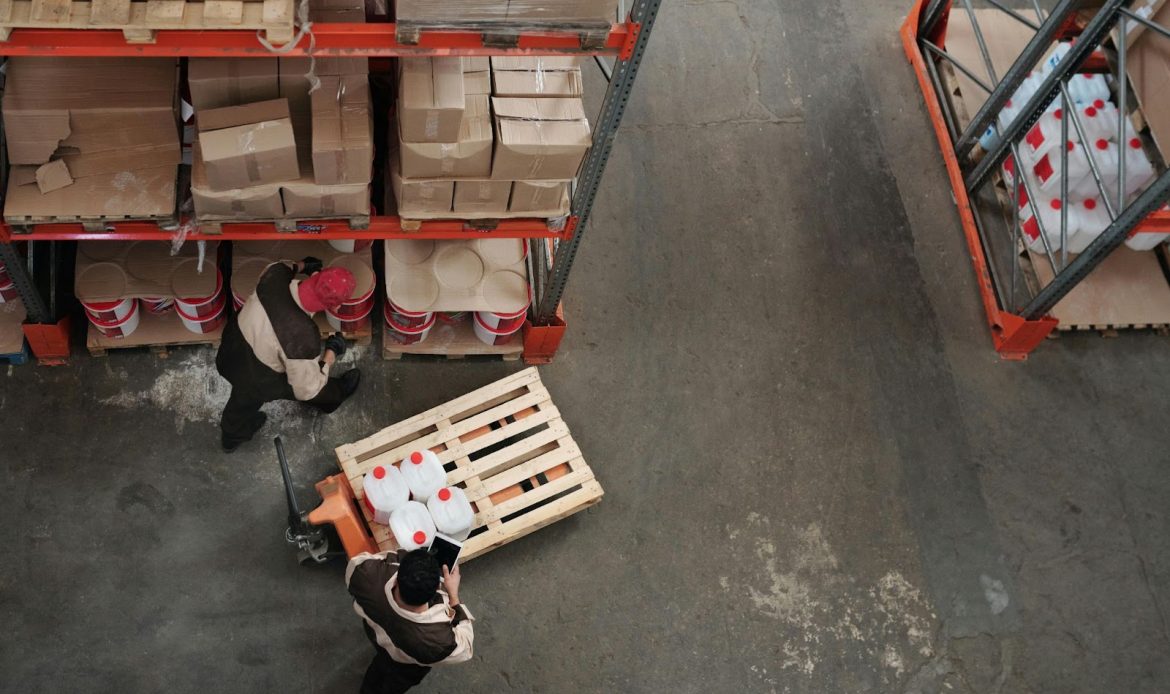 Two Men Working On Warehouse