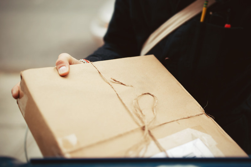 Man Holding Delivery Parcel