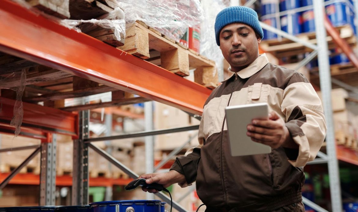 Young Man Busy Working In A Fulfilment Centre