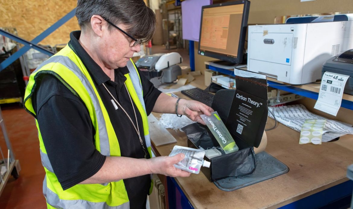 Woman Checking and Packing Goods